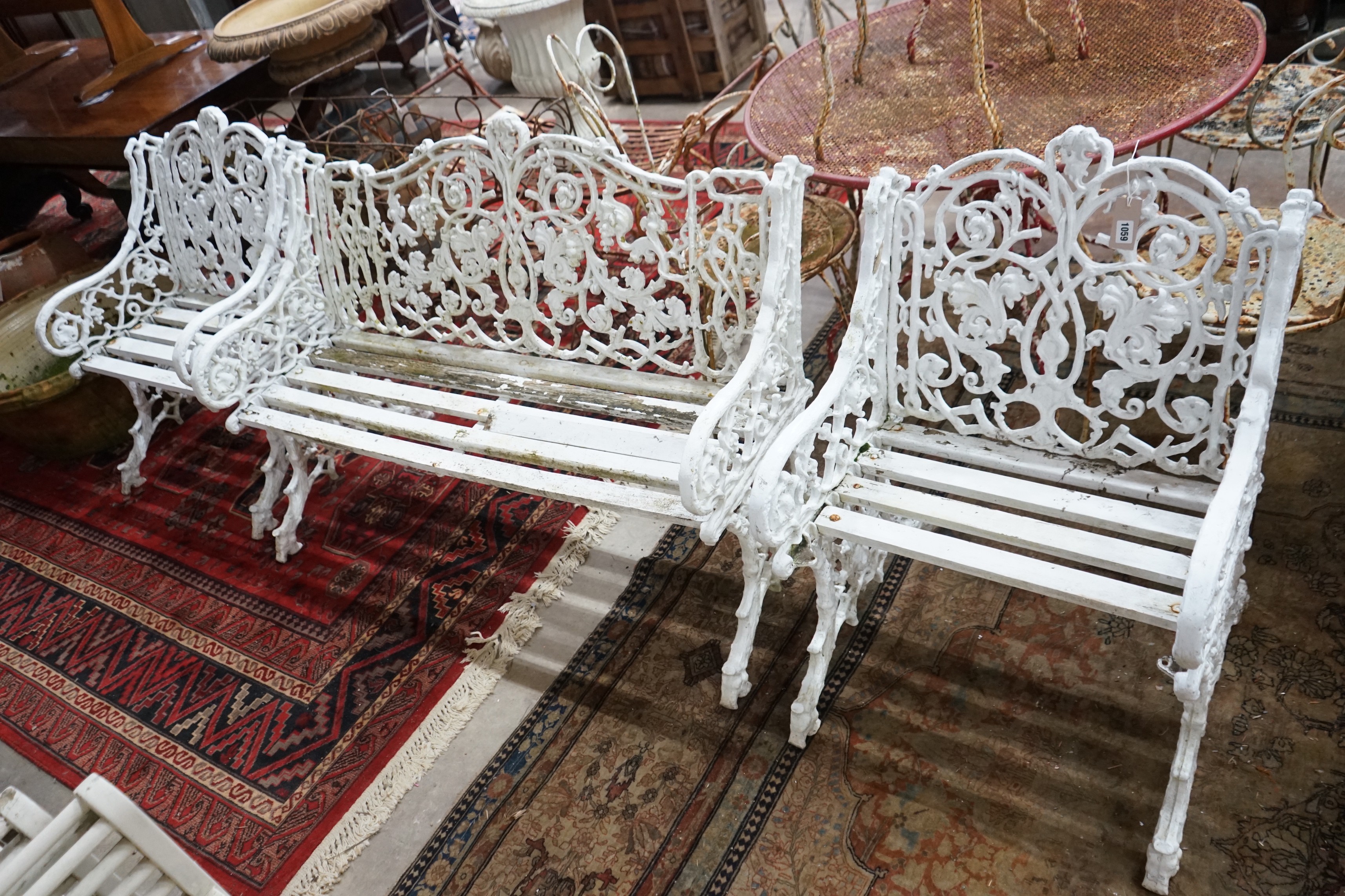 A Victorian style cast metal slatted garden bench, length 127cm, depth 60cm, height 86cm and two chairs